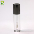 empty round plastic clear lipstick container with black cap